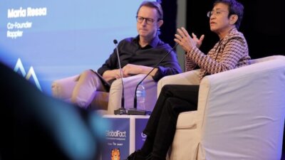 Maria Ressa, right, speaks with AFP's Phil Chetwynd during the GlobalFact 11 fact-checking summit. Credit: Vanja Čerimagić